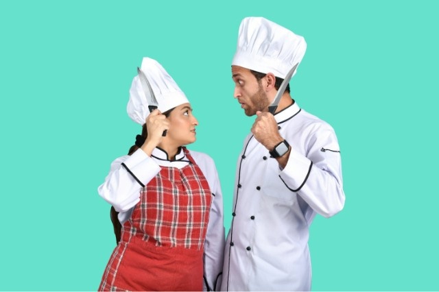 a man and a woman wearing white hats and looking at each other