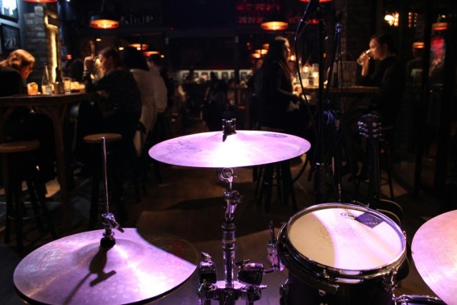 A group of people sitting around a bar