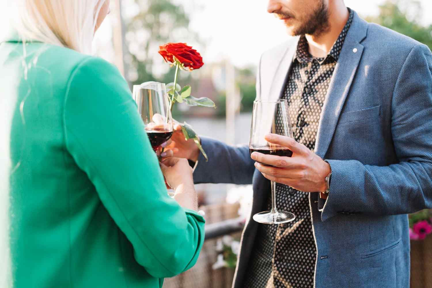 Man giving red rose to his girlfriend while drinking wine as Dating Rules, Modern Etiquette